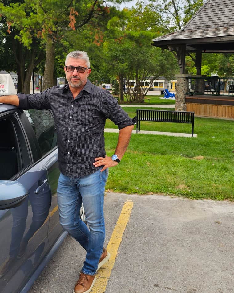 Igor Isaev beside his dual-control instruction car at Jackson's Point, Georgina
