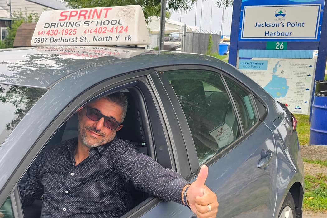 Igor Isaev and his dual-control car at Jackson's Point Harbour in Georgina
